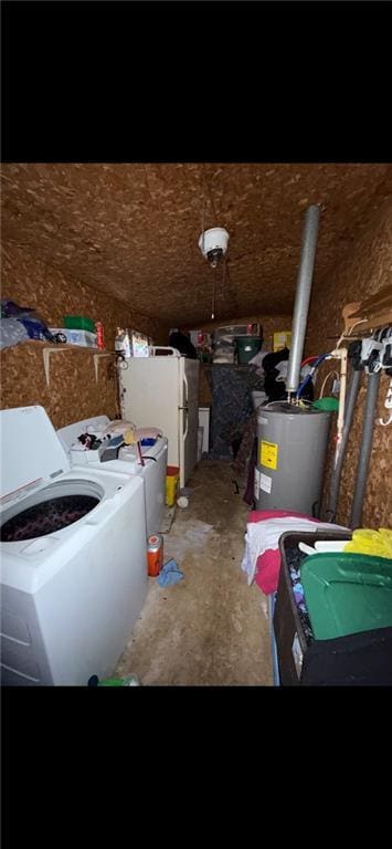 interior space with water heater and washing machine and clothes dryer
