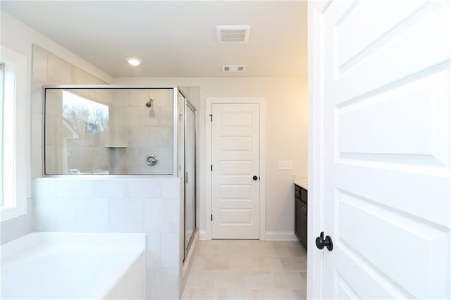 full bath with visible vents, a shower stall, vanity, and a bath