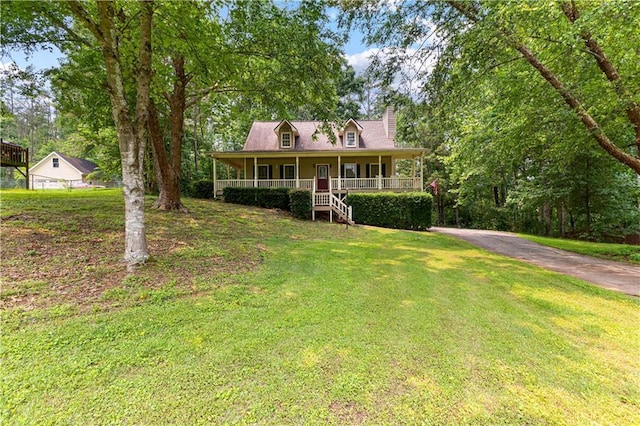 59 Cedar Way, Dallas, GA 30132 - view of front facade with covered porch, a chimney, a front yard, and driveway