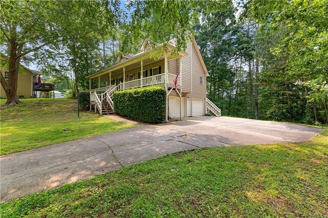 59 Cedar Way, Dallas, GA 30132 - view of front of property with stairway, a garage, a front lawn, a porch, and concrete driveway