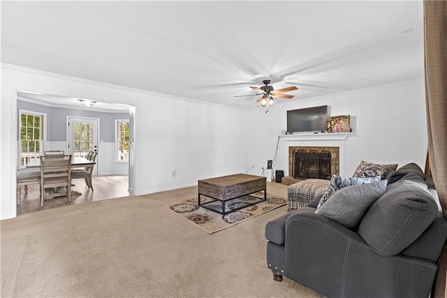59 Cedar Way, Dallas, GA 30132 - carpeted living room featuring a ceiling fan, crown molding, a stone fireplace, and baseboards
