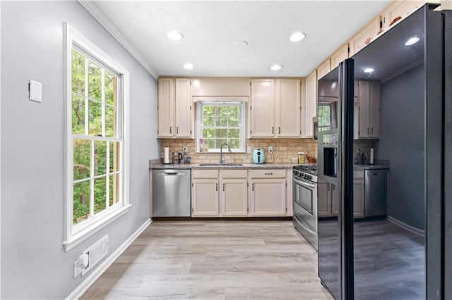 59 Cedar Way, Dallas, GA 30132 - kitchen with appliances with stainless steel finishes, a sink, decorative backsplash, recessed lighting, and baseboards