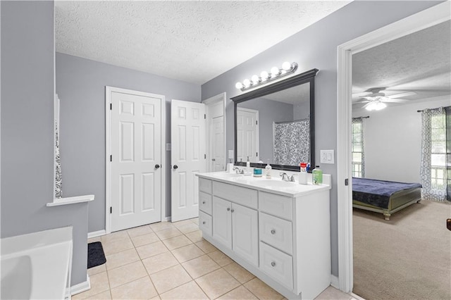 59 Cedar Way, Dallas, GA 30132 - ensuite bathroom with a textured ceiling, double vanity, a ceiling fan, tile patterned flooring, and baseboards