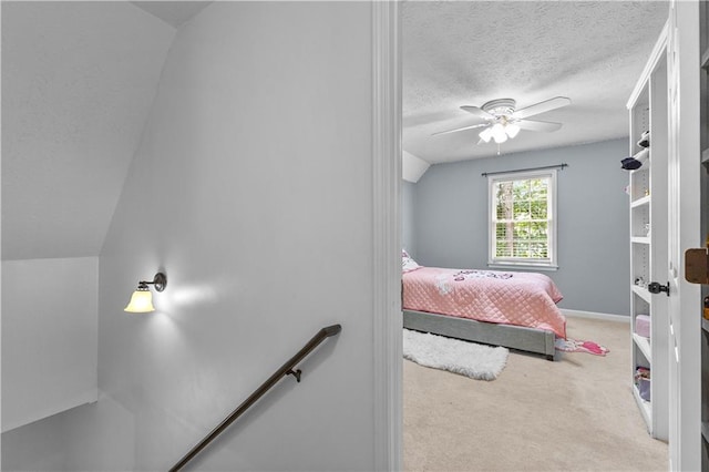 59 Cedar Way, Dallas, GA 30132 - carpeted bedroom featuring a textured ceiling, baseboards, ceiling fan, and lofted ceiling