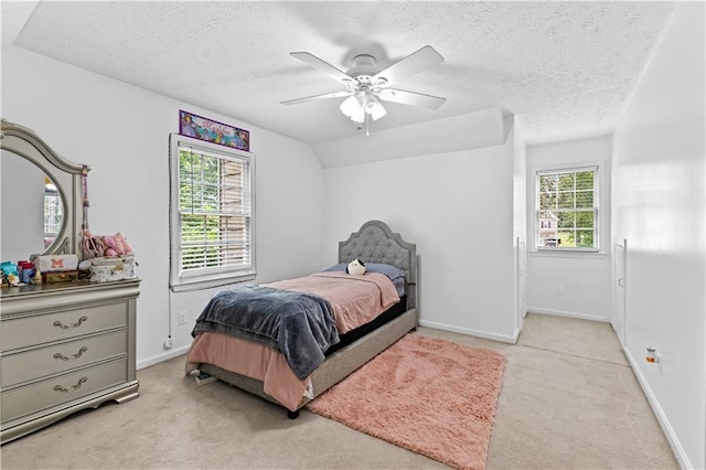 59 Cedar Way, Dallas, GA 30132 - bedroom with light colored carpet, a textured ceiling, baseboards, and ceiling fan