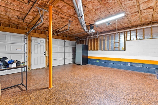 59 Cedar Way, Dallas, GA 30132 - garage with freestanding refrigerator and concrete block wall