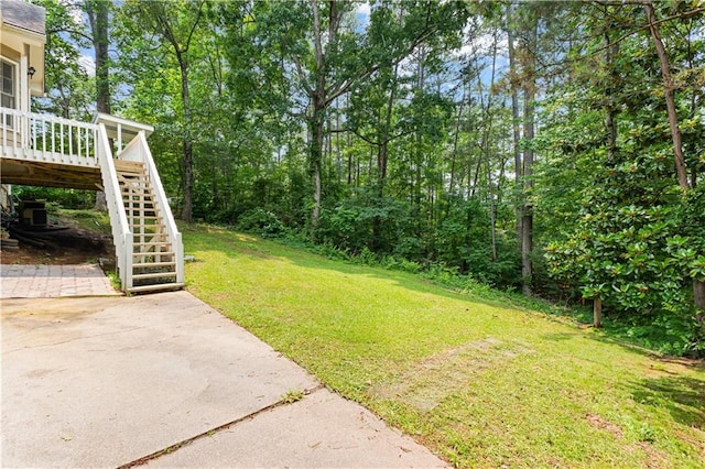 59 Cedar Way, Dallas, GA 30132 - view of green lawn featuring stairs, a patio, and a deck