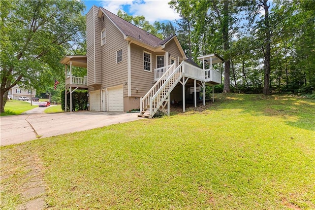 59 Cedar Way, Dallas, GA 30132 - view of front of home with stairway, an attached garage, concrete driveway, and a front lawn