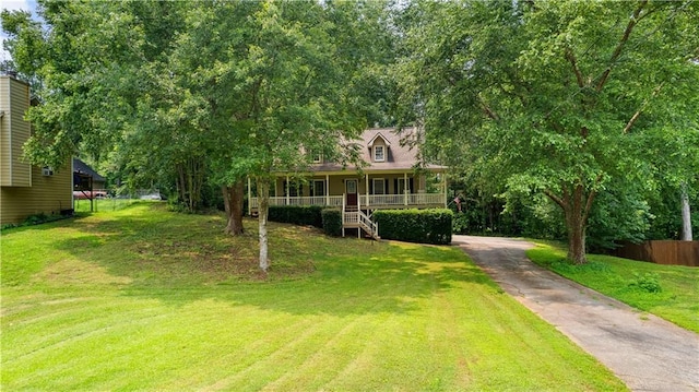 59 Cedar Way, Dallas, GA 30132 - view of front of house featuring a porch, asphalt driveway, and stairway