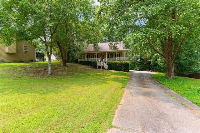 59 Cedar Way, Dallas, GA 30132 - view of front of house featuring covered porch, a front yard, and driveway