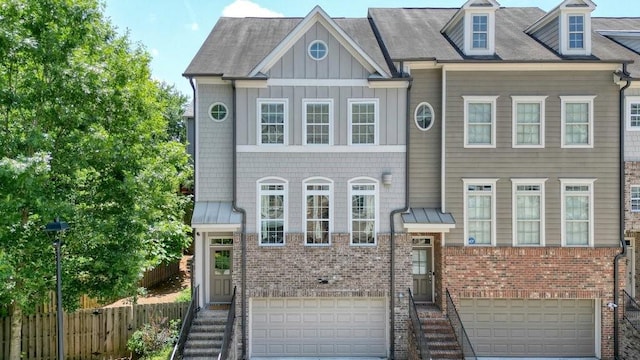 2093 Callaway Ct NW, Atlanta, GA 30318 - view of property with an attached garage, brick siding, board and batten siding, and driveway