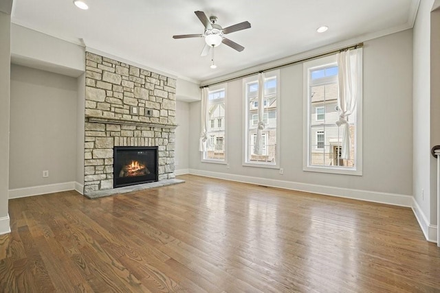 2093 Callaway Ct NW, Atlanta, GA 30318 - unfurnished living room featuring ceiling fan, a fireplace, ornamental molding, wood finished floors, and baseboards