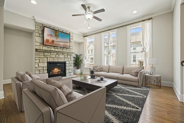 2093 Callaway Ct NW, Atlanta, GA 30318 - living room with baseboards, crown molding, a ceiling fan, a stone fireplace, and wood finished floors
