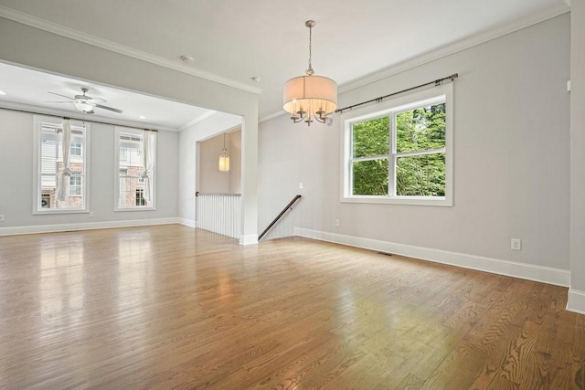 2093 Callaway Ct NW, Atlanta, GA 30318 - empty room featuring crown molding, wood finished floors, baseboards, and a chandelier