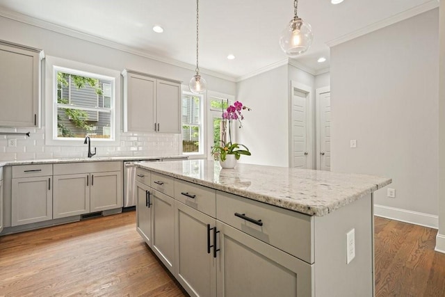 2093 Callaway Ct NW, Atlanta, GA 30318 - kitchen featuring a sink, healthy amount of natural light, backsplash, light wood finished floors, and ornamental molding
