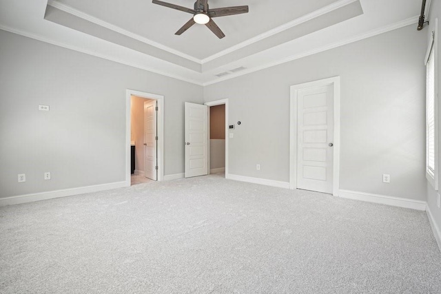 2093 Callaway Ct NW, Atlanta, GA 30318 - unfurnished bedroom with a raised ceiling, crown molding, light colored carpet, baseboards, and ensuite bath