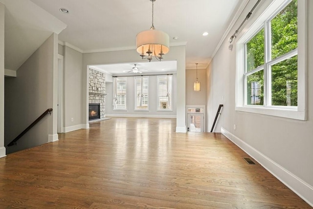 2093 Callaway Ct NW, Atlanta, GA 30318 - unfurnished living room featuring healthy amount of natural light, wood finished floors, crown molding, and recessed lighting