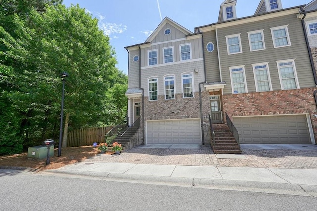 2093 Callaway Ct NW, Atlanta, GA 30318 - view of property featuring a garage, decorative driveway, and brick siding