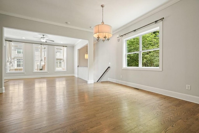 2093 Callaway Ct NW, Atlanta, GA 30318 - unfurnished room with wood finished floors, crown molding, baseboards, a chandelier, and ceiling fan