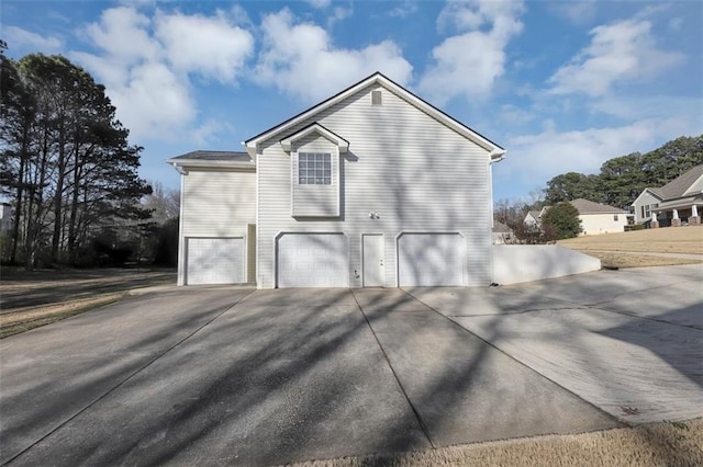 view of property exterior with a garage