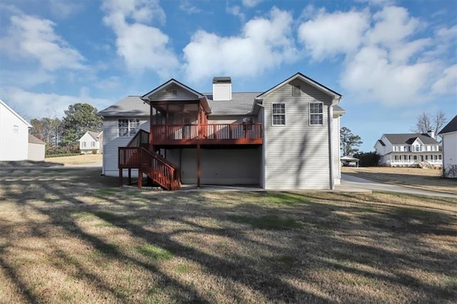 back of house with a yard and a wooden deck