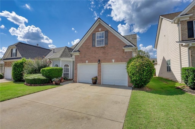 view of property with a garage and a front lawn