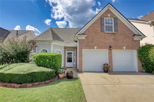 view of front of property with a garage and a front yard