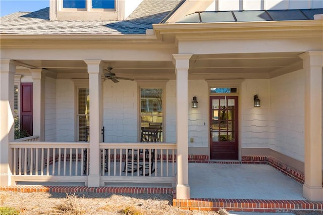 entrance to property with ceiling fan and a porch