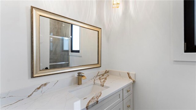 bathroom featuring tile patterned floors and vanity