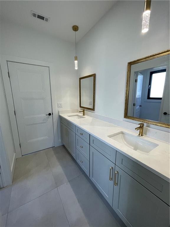 bathroom with vanity and tile patterned flooring