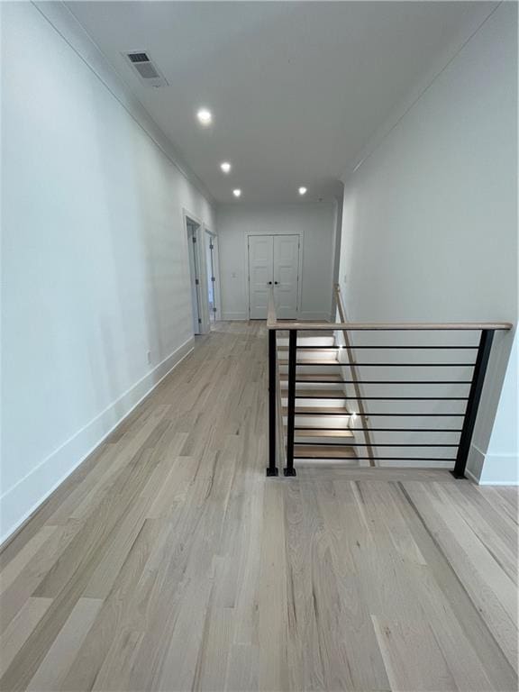 stairway featuring hardwood / wood-style flooring