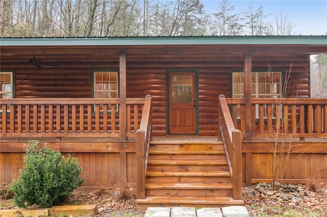 wooden terrace featuring covered porch