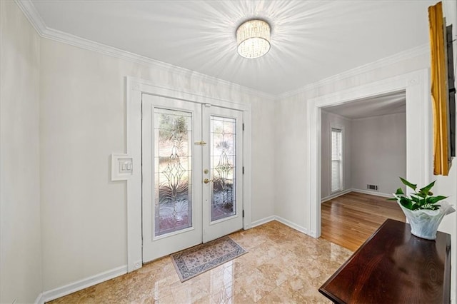 doorway with baseboards, visible vents, ornamental molding, and french doors