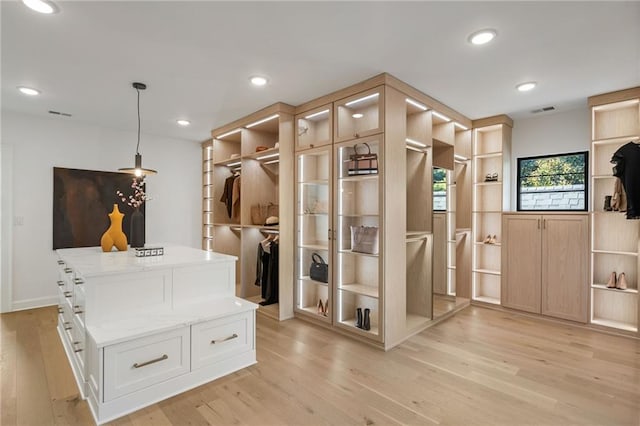 mudroom with recessed lighting, visible vents, and light wood-style floors