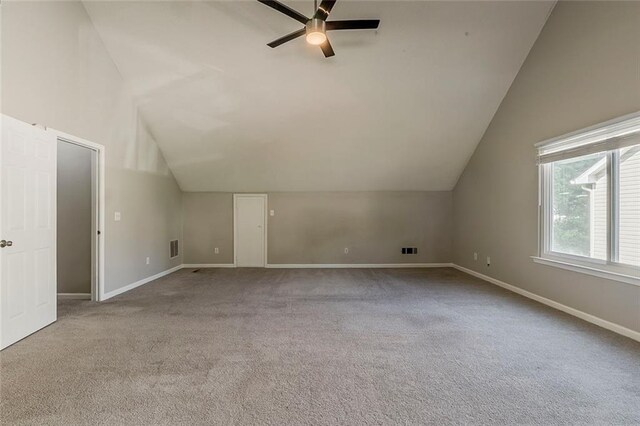 bonus room featuring a ceiling fan, visible vents, vaulted ceiling, baseboards, and carpet flooring