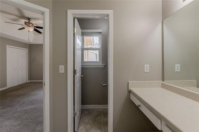 bathroom featuring baseboards, a ceiling fan, and tile patterned floors