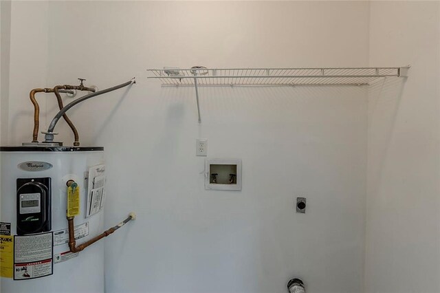 washroom with laundry area, electric dryer hookup, washer hookup, and electric water heater