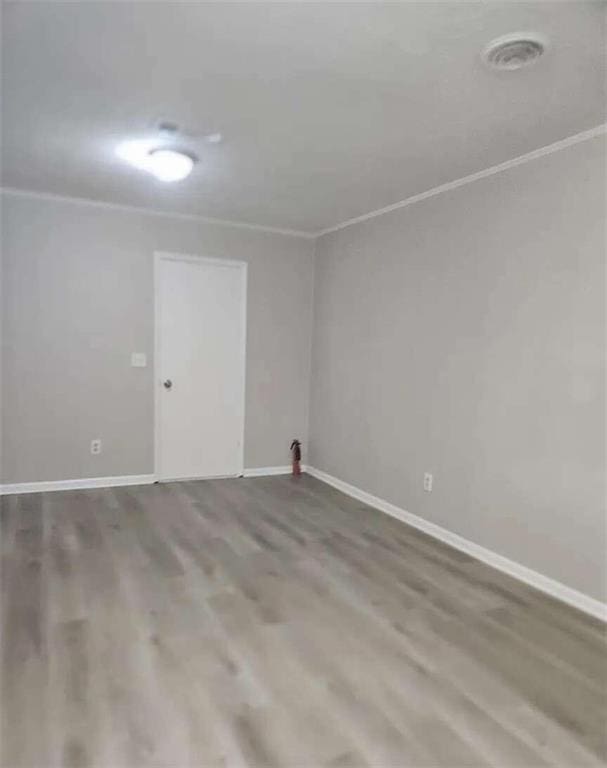 spare room with hardwood / wood-style flooring