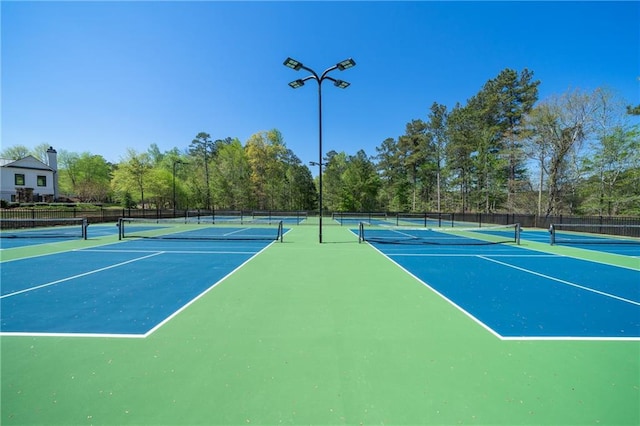 view of tennis court with fence