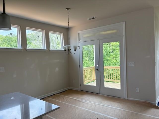 385 Riverwood Pass, Dallas, GA 30157 - doorway featuring french doors, a chandelier, and carpet floors