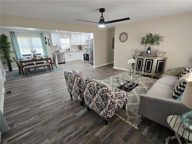 living room with sink, hardwood / wood-style floors, and ceiling fan