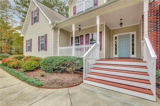 doorway to property with covered porch