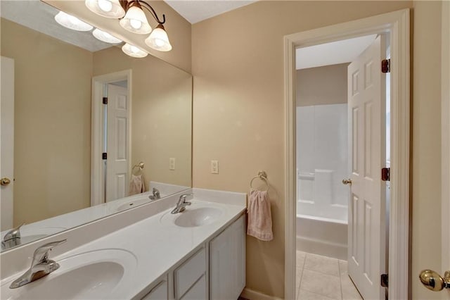 bathroom with tile patterned floors and vanity