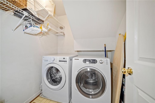 clothes washing area featuring separate washer and dryer