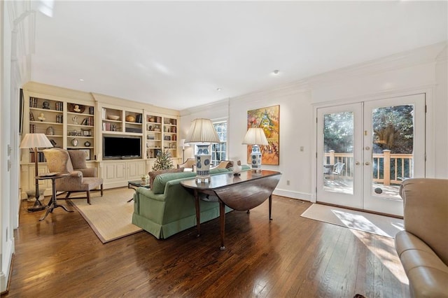 living room with french doors, crown molding, and hardwood / wood-style flooring