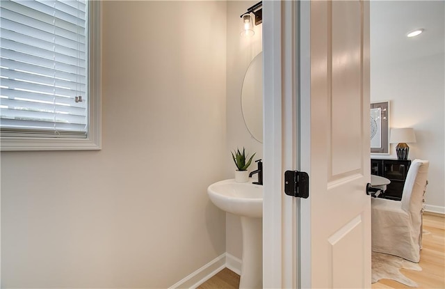 bathroom with hardwood / wood-style floors