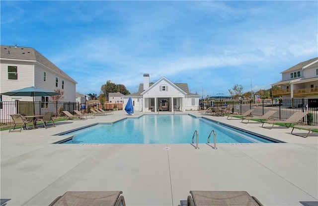 view of swimming pool featuring a patio area