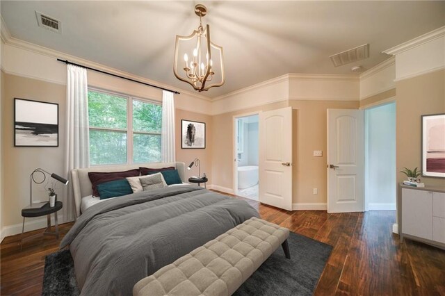 bedroom featuring dark hardwood / wood-style floors, ensuite bath, crown molding, and a chandelier