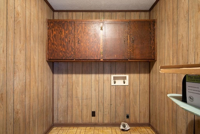 101 Beaver Run, Lagrange, GA 30241 - laundry area with cabinet space, hookup for an electric dryer, wood walls, and washer hookup