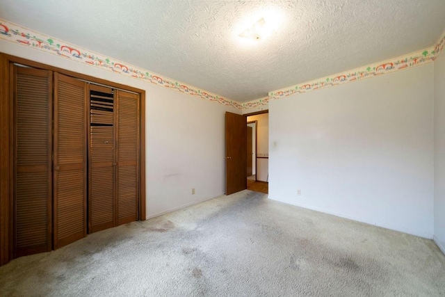 101 Beaver Run, Lagrange, GA 30241 - unfurnished bedroom with carpet floors, a closet, and a textured ceiling